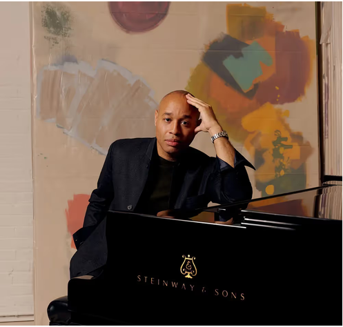 Aaron Diehl sitting at piano